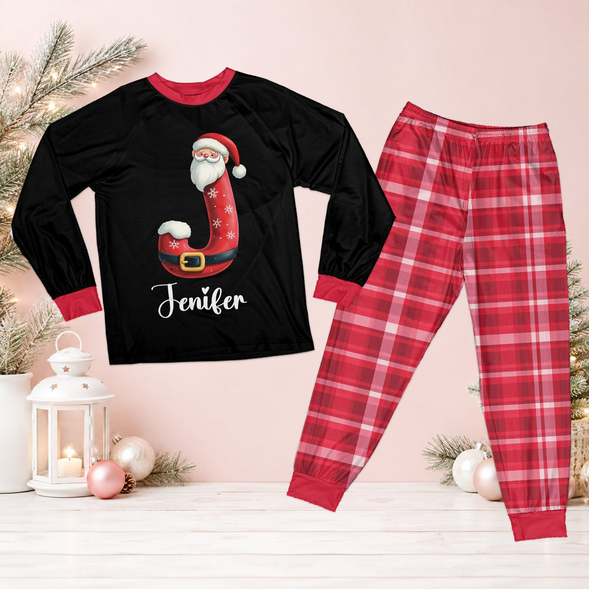 Personalized christmas pajama set featuring a Santa alphabet letter, custom name, and red plaid pants, front view