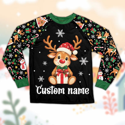 Matching family christmas pajama set featuring a cute reindeer with Santa hat and custom name, displayed against a clean background.