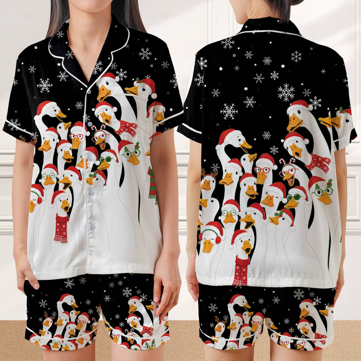 Black christmas pajama set folded showing festive duck design