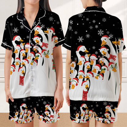 Black christmas pajama set folded showing festive duck design