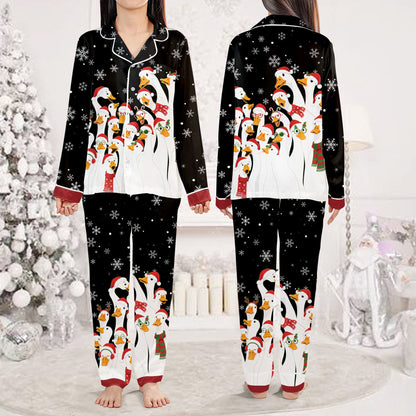 Black christmas pajama set top featuring a holiday duck and snowflake pattern