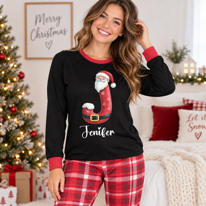 Lifestyle view of the matching xmas family pajamas being worn in a cozy holiday setting