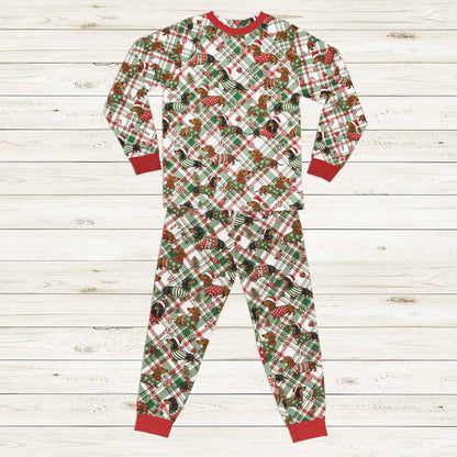 Matching family plaid pajamas featuring festive Christmas dachshunds, front view