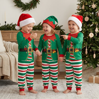 Family wearing matching xmas family pajamas in a festive living room