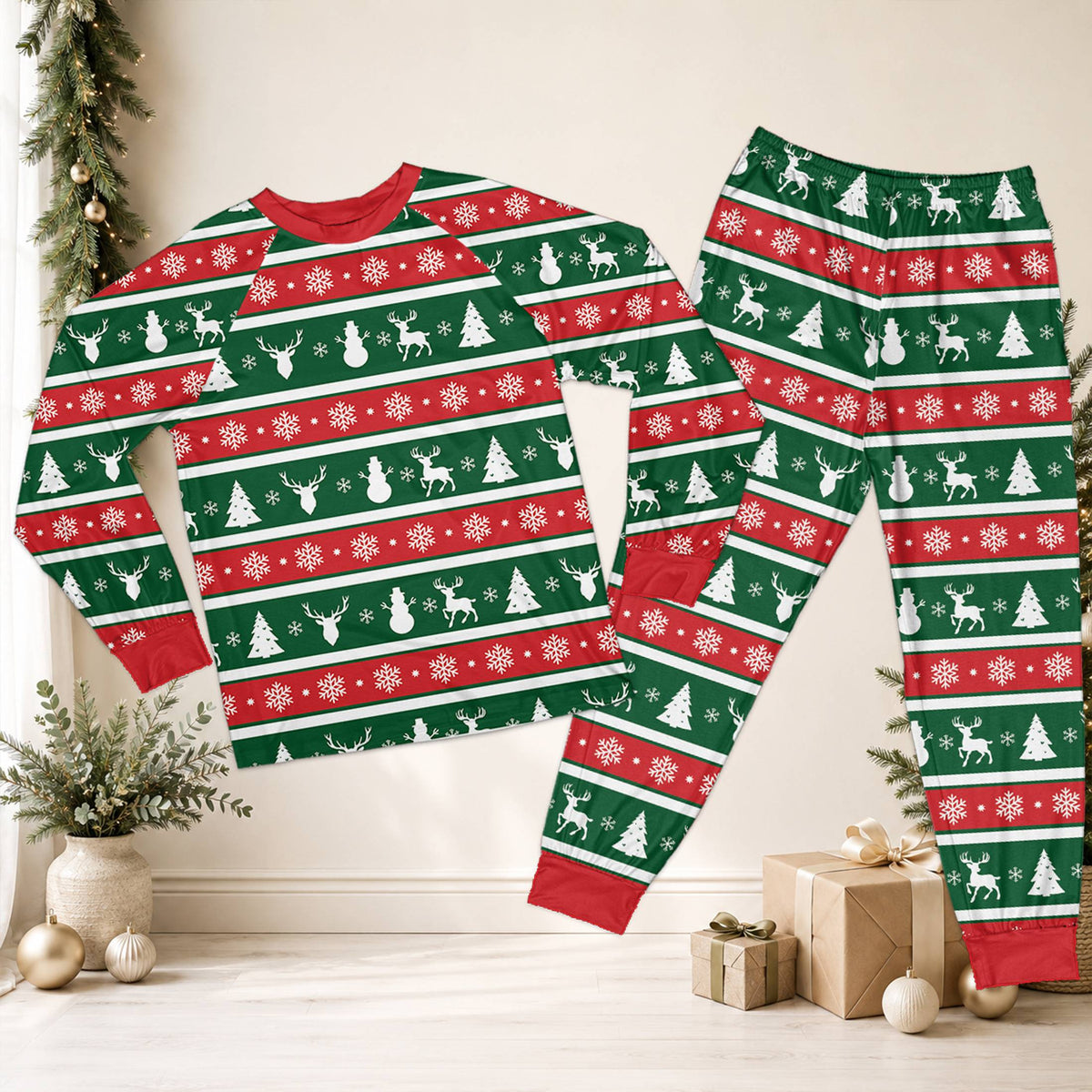 Festive christmas pajama set featuring red and green stripes with white reindeer and snowman silhouettes, front view