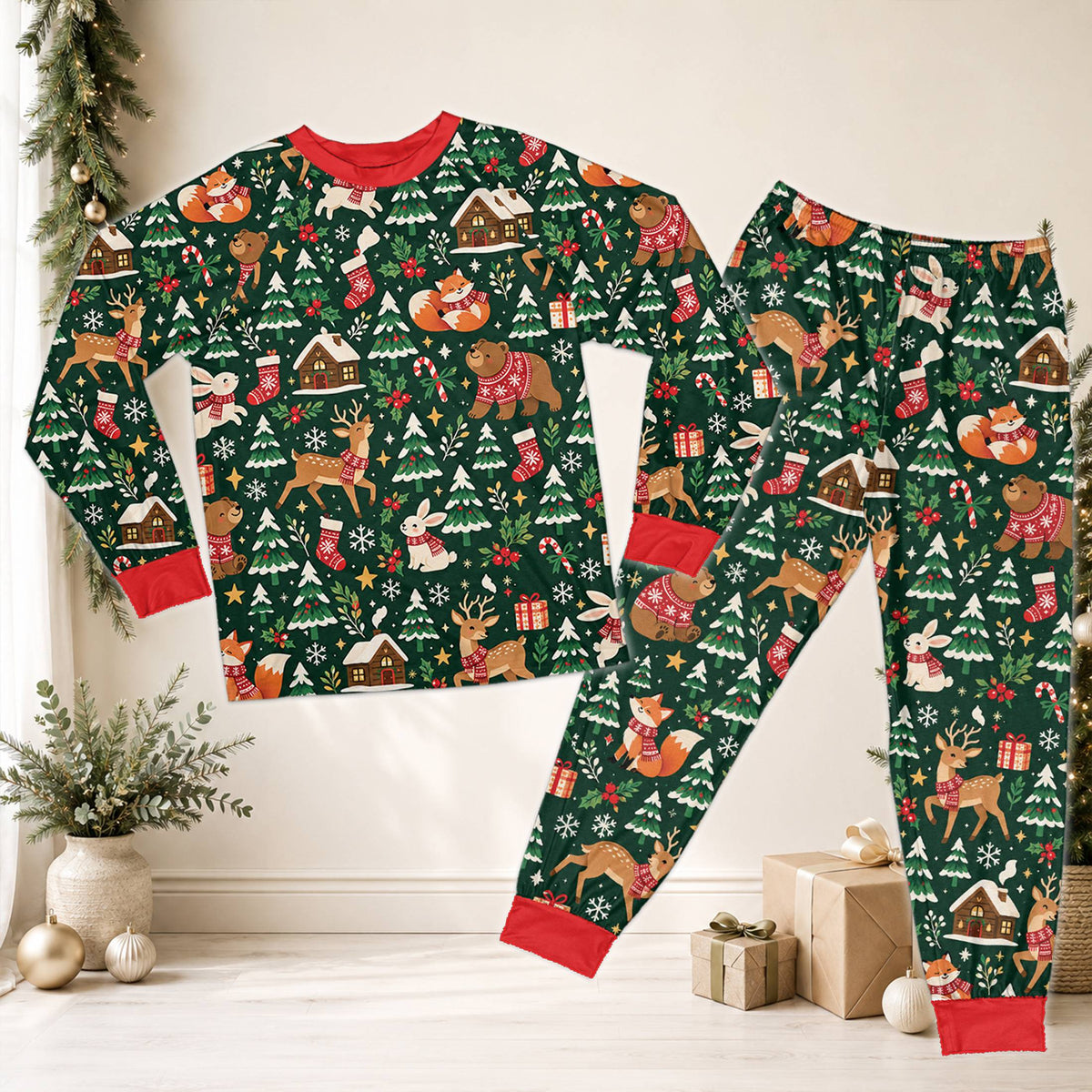 Festive green christmas pajama set featuring woodland creatures and holiday motifs, front view.