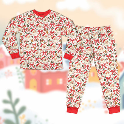Detailed view of the family matching holiday pajamas showcasing candy canes and holly berries on a white background.