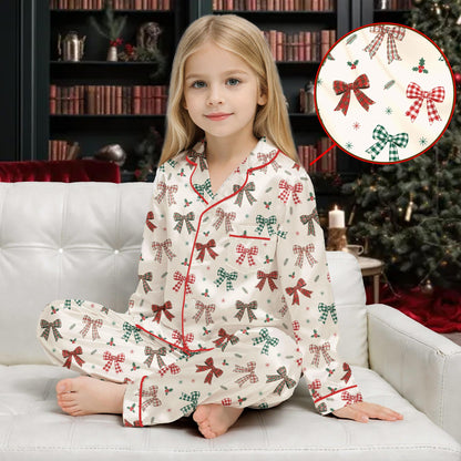 Front view of matching family pajamas showcasing festive plaid bows