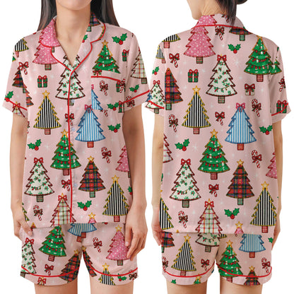 Main view of the pink patterned christmas pajama set featuring colorful holiday trees