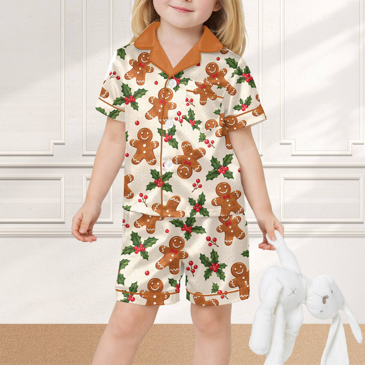 Family sitting around the tree in their gingerbread christmas pajama set