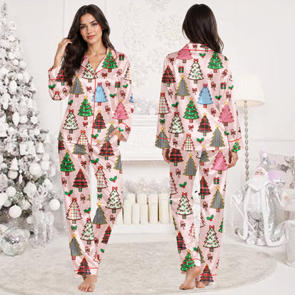 Lifestyle view of a family enjoying the holiday season in matching pink pajamas