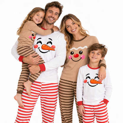 Family wearing matching snowman and gingerbread christmas pajama sets, lifestyle view