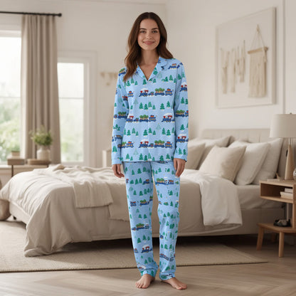 Lifestyle view of family wearing matching xmas family pajamas with toy train design