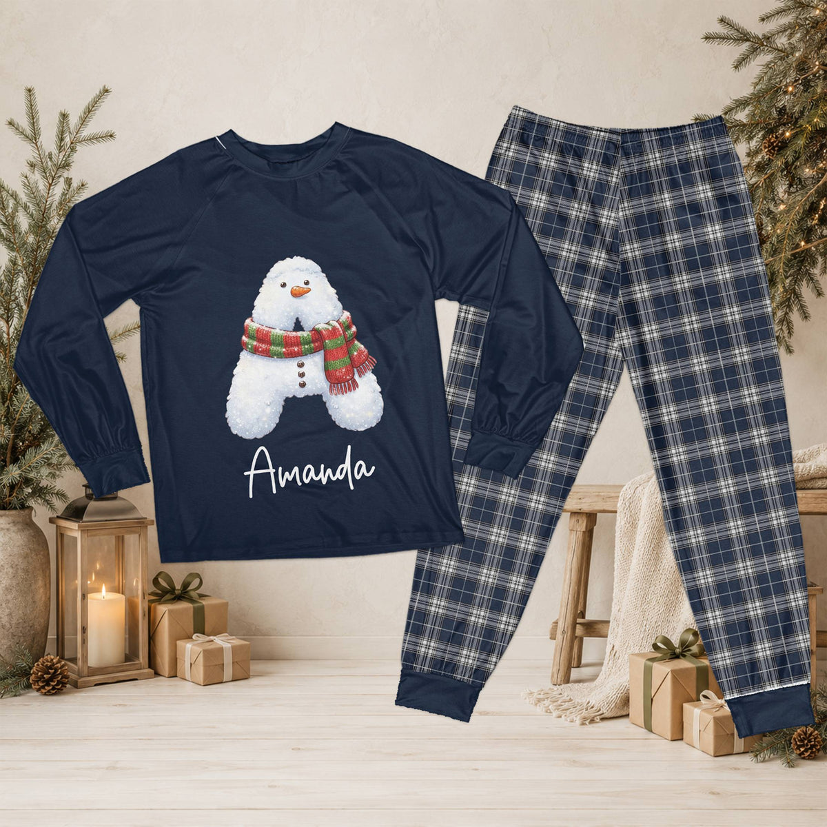 Personalized navy christmas pajama set with snowman initial and custom name on top with plaid pants front view