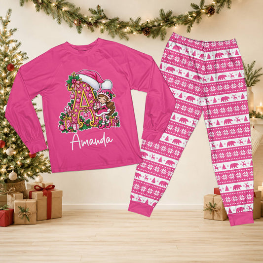 Personalized pink christmas pajama set featuring an elf and Santa hat initial design with custom name, front view