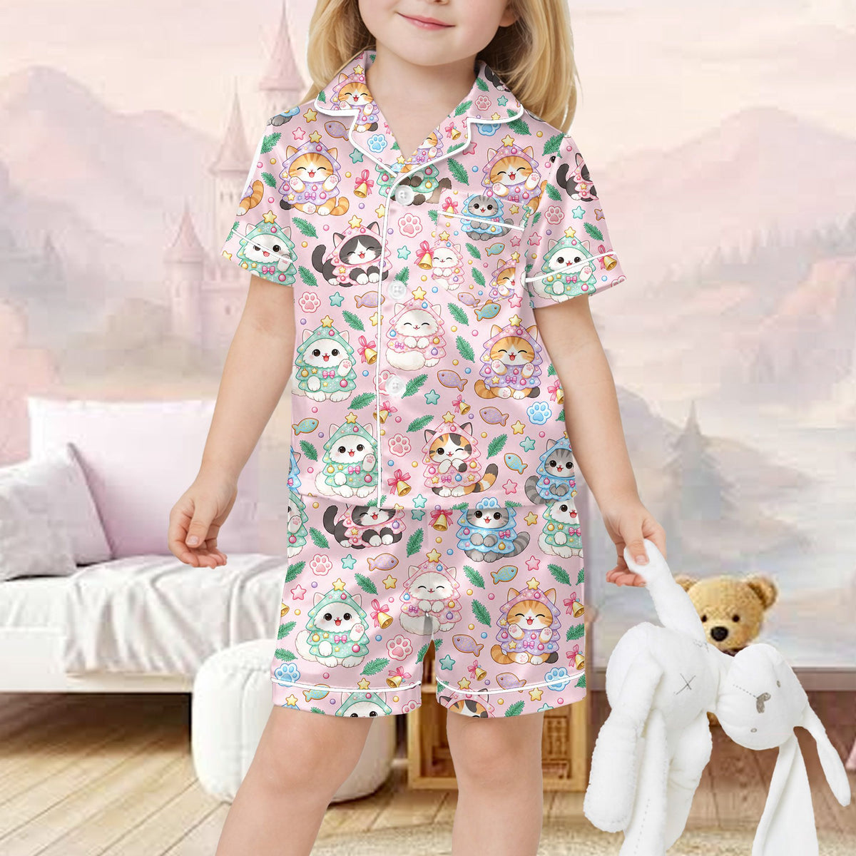Light pink christmas pajama set featuring kawaii cats in Christmas tree costumes, front view