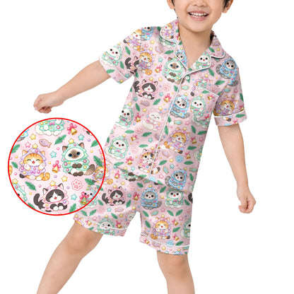 Close-up lifestyle view highlighting the holiday cat pattern on the pink pajama set