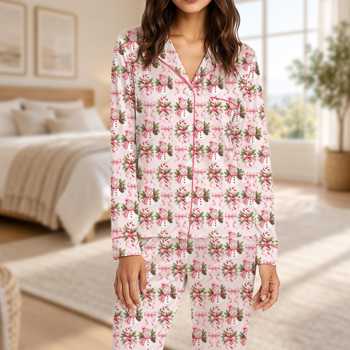 Close-up lifestyle view of the festive snowman print on the pajamas