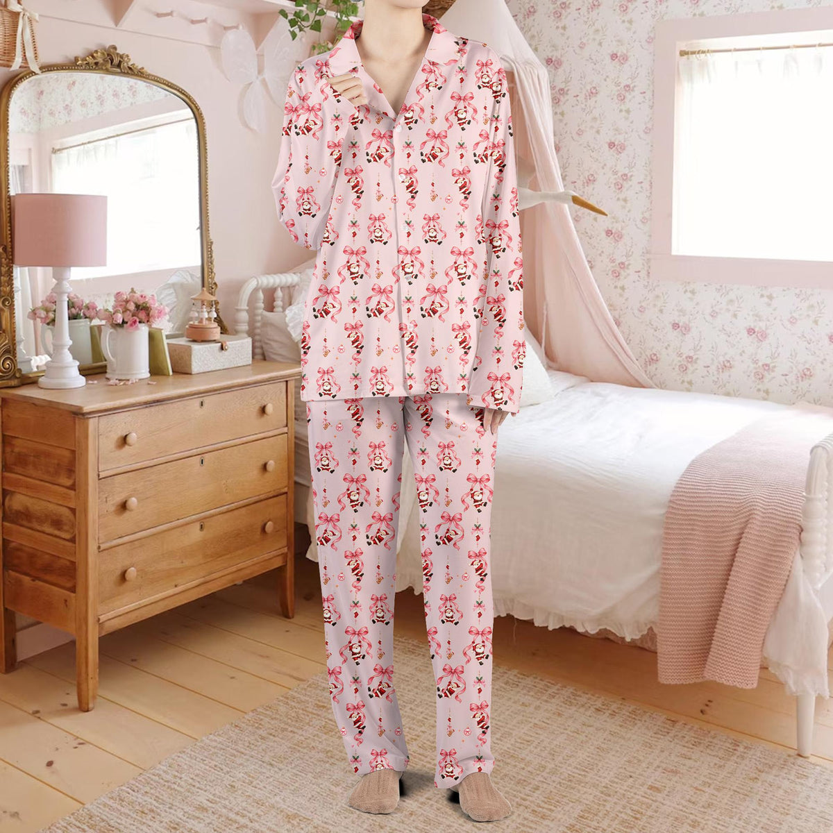 Family matching holiday pajamas with Santa and bows, lifestyle view 4