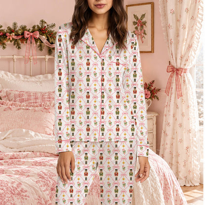 Lifestyle view of the pink ribbon and nutcracker pattern pajama set