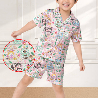 Lifestyle view of someone wearing the pink kawaii cat matching family xmas pajamas indoors