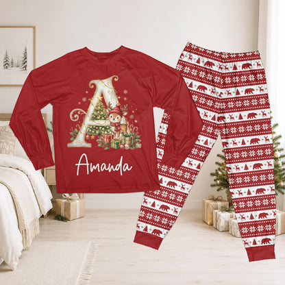 Front view of a personalized red christmas pajama set featuring a custom name, reindeer, and holiday striped pants
