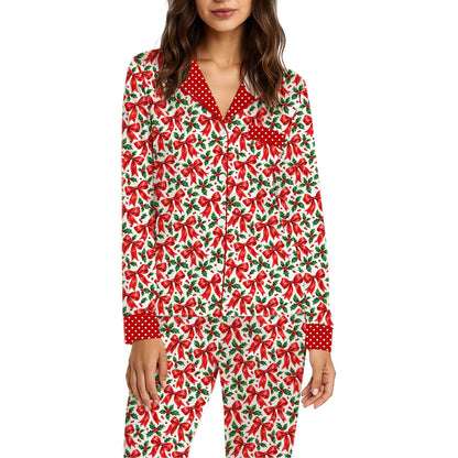 Christmas pajama set with red bows and green holly on a white background, front view