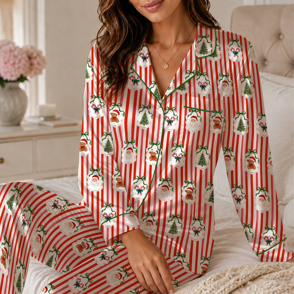Matching family pajama set featuring red and white stripes with Santa and teddy bears, front view