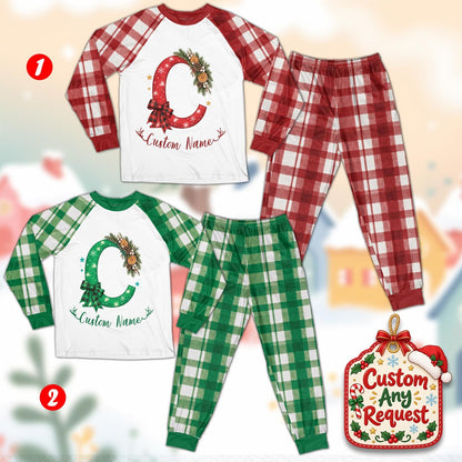 Close-up front view of the personalized holiday pajama top and plaid sleeves