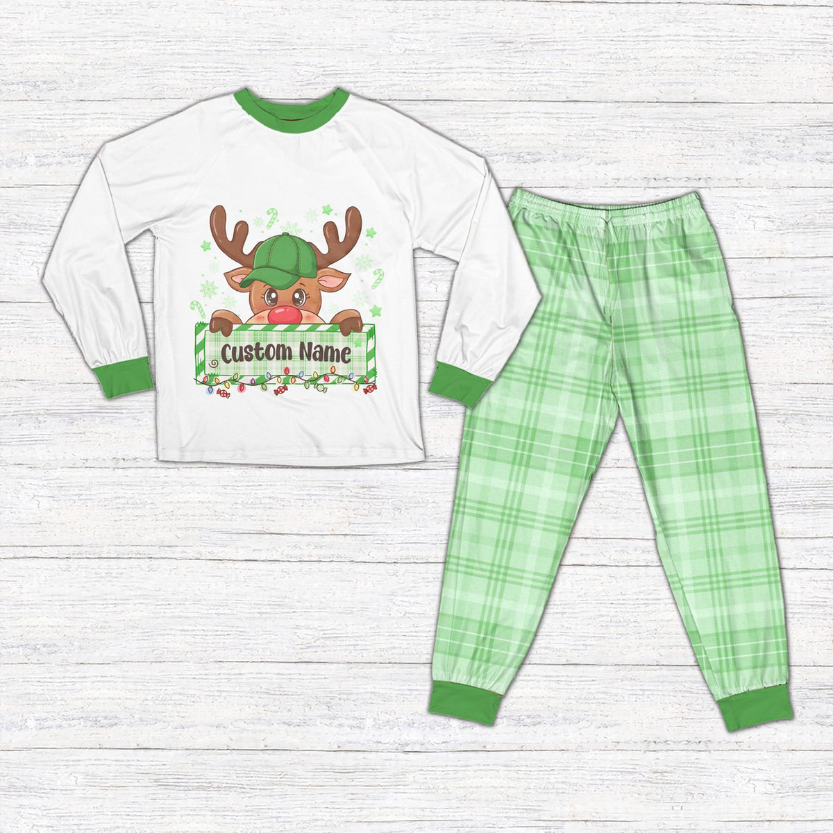 Matching family christmas pajama set with reindeer design and white shirt, front view