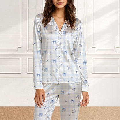 Detailed front view of the delicate blue floral clusters and soft blue bows on the pajama set