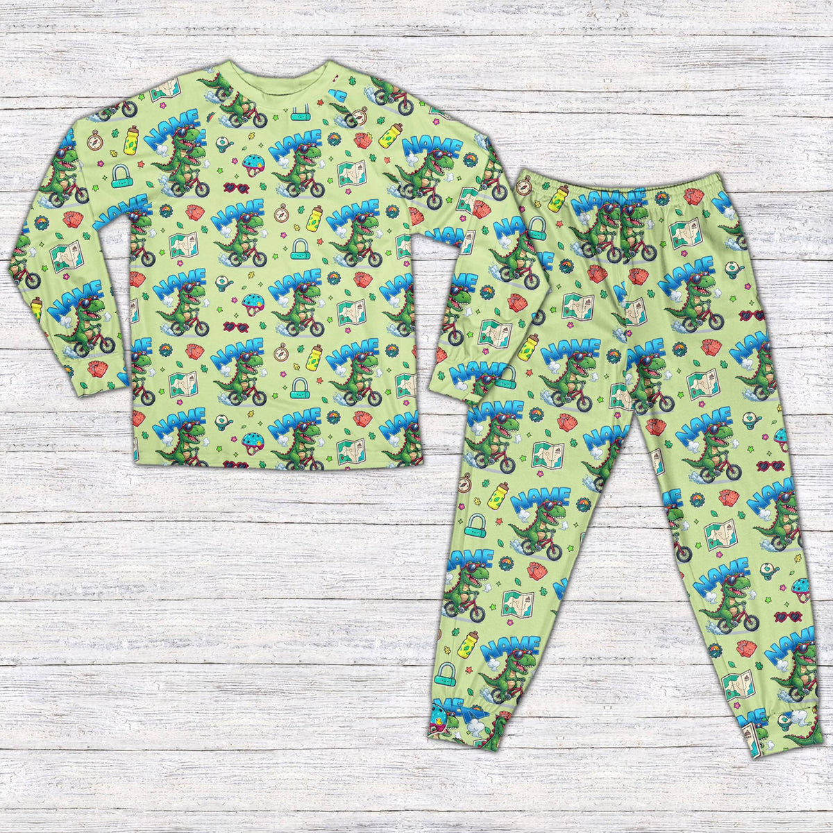 Dinosaur bike pajama set in green for matching family, front view