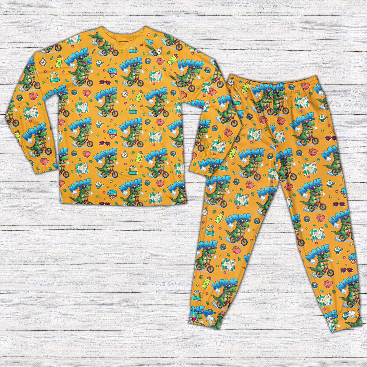 Dinosaur bike pajama set in orange for matching family, front view