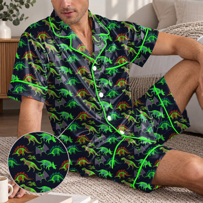 Lifestyle view of a man wearing the neon dinosaur skeleton matching family pajamas