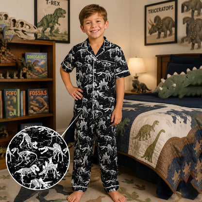 Lifestyle view of the dinosaur skeletons pajama set in black and white