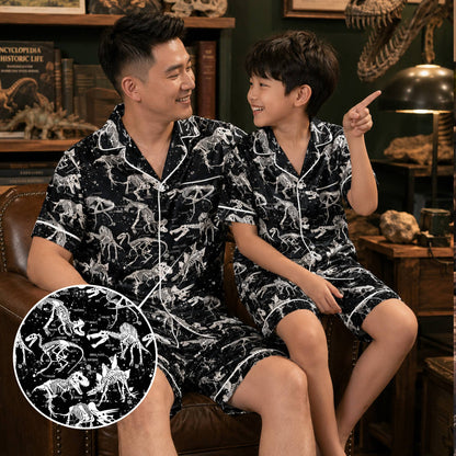Close up of the dinosaur skeleton pattern on black pajamas
