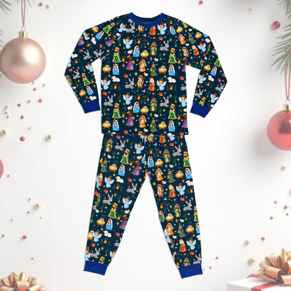 Close-up lifestyle view of the family pajama set holiday with multicolor nativity design