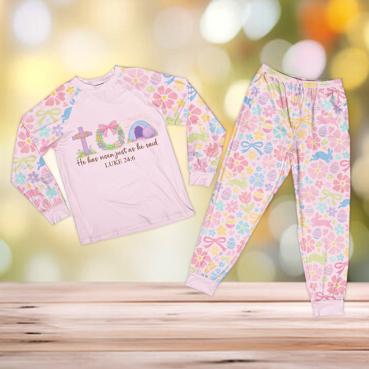 Pink long-sleeve top faith pajama set with pastel patterned sleeves and pants, front view