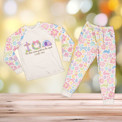 Family wearing the faith pajama set with He has risen graphic and pastel patterns, front view