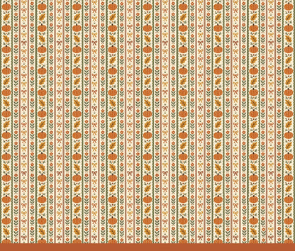 Close-up detail showing the pumpkin, oak leaf, and floral vine pattern on the pajama fabric