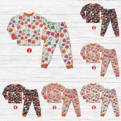 Front view of the multicolor fall pajama top showcasing the custom name on pumpkins