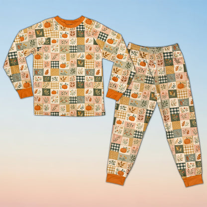 Fall pajama set featuring an autumn patchwork pattern of pumpkins and plaid, close front view
