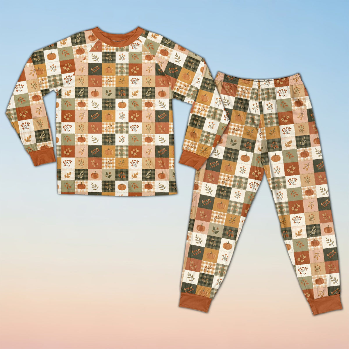 Fall pajama set featuring an autumn patchwork pattern of pumpkins and plaid, detailed front view