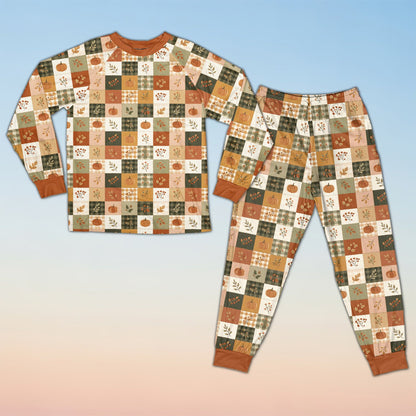Fall pajama set featuring an autumn patchwork pattern of pumpkins and plaid, detailed front view