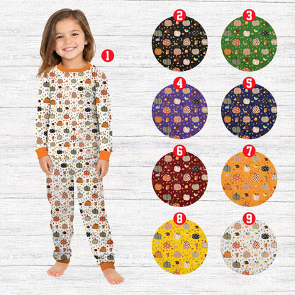 Lifestyle view of the autumn pumpkin matching family pajamas.