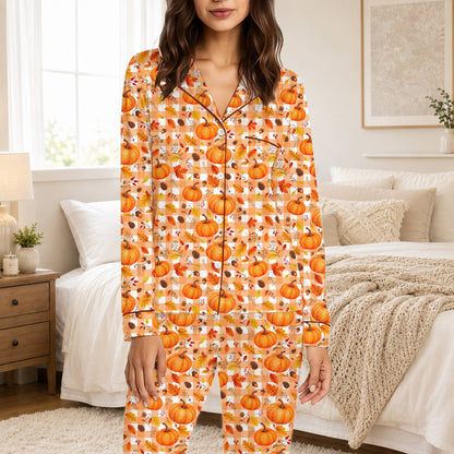 Lifestyle view of a family wearing the fall pumpkin matching pajamas