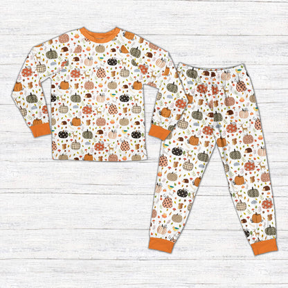 Front view of the autumn pumpkin family pajama set.