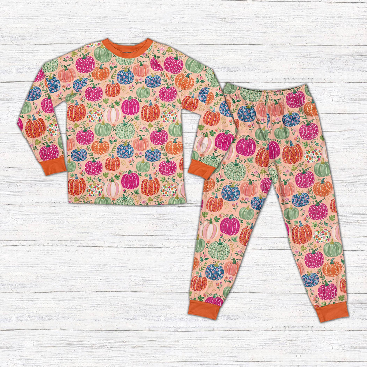 Pink front view of the personalized autumn pajama set with floral pumpkins
