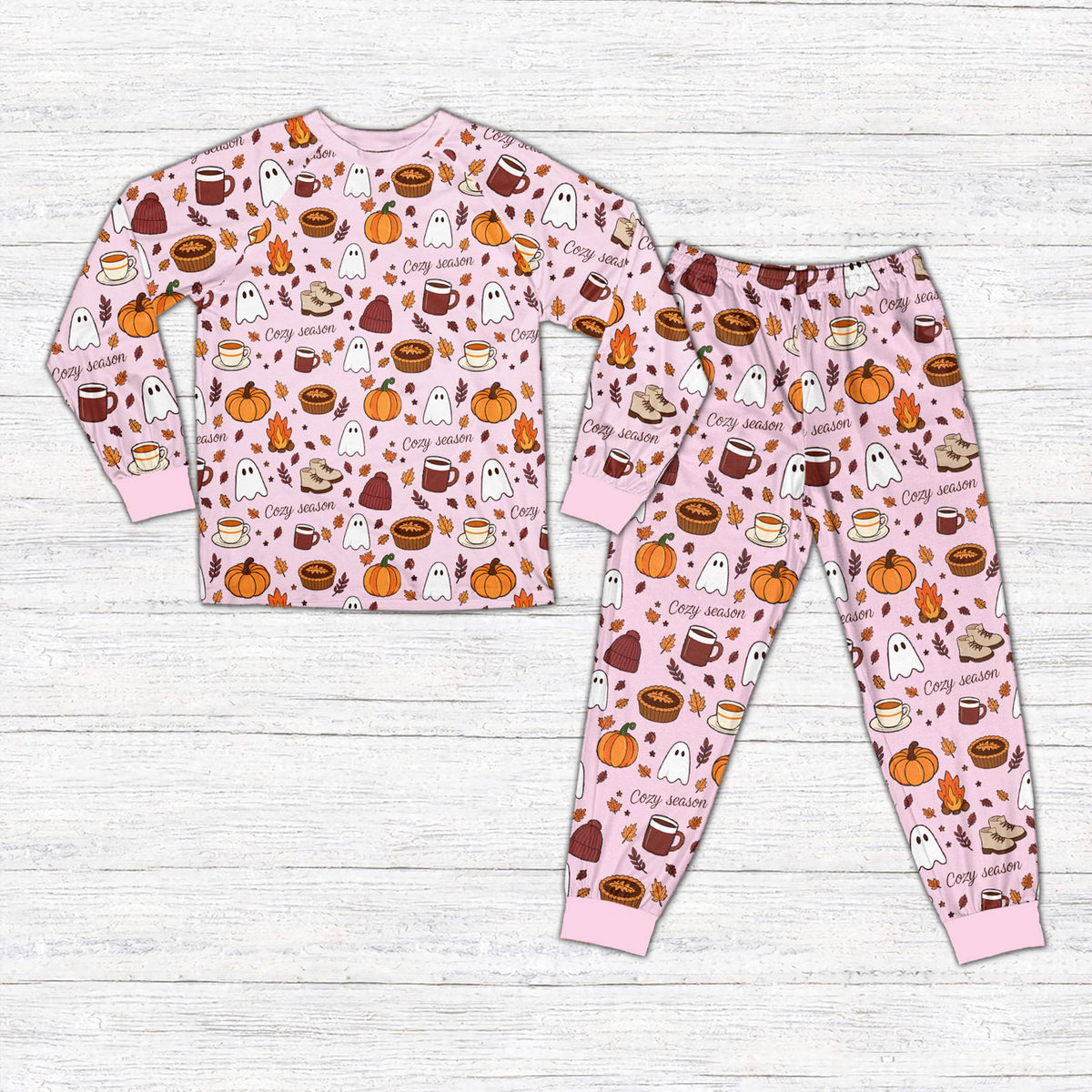 Pink fall pajama set with cozy season design, front view