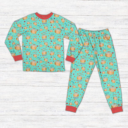 Fall pajama set in teal featuring autumn pumpkin and ribbon design